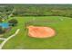 Ball field with covered picnic area and mature landscaping, providing outdoor recreational activities at 1640 Wild Indigo Ter, Oviedo, FL 32766