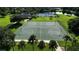 Close-up of community basketball court surrounded by trees and manicured lawns, offering recreational activity at 1640 Wild Indigo Ter, Oviedo, FL 32766