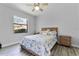 Cozy bedroom with a wooden bed frame and wood-style flooring at 1640 Wild Indigo Ter, Oviedo, FL 32766