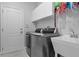 Well-organized laundry room with modern washer and dryer at 1640 Wild Indigo Ter, Oviedo, FL 32766
