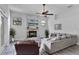 Comfortable living room with a stone fireplace, modern decor, and ample natural light at 1640 Wild Indigo Ter, Oviedo, FL 32766