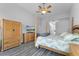 Comfortable main bedroom offers stylish furniture, ceiling fan, and spacious layout at 1640 Wild Indigo Ter, Oviedo, FL 32766