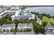 Aerial view of the townhome complex, near a lake and with mature landscaping at 1649 Lake Baldwin Ln, Orlando, FL 32814