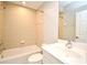 Bathroom with a bathtub and shower, tiled walls, and a white vanity with a sink at 1649 Lake Baldwin Ln, Orlando, FL 32814