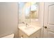 Bathroom vanity featuring a modern faucet, mirror, and white door at 1649 Lake Baldwin Ln, Orlando, FL 32814