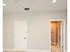 This spacious bedroom has neutral walls, carpet and ensuite bathroom access at 1649 Lake Baldwin Ln, Orlando, FL 32814