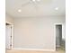 Neutral bedroom featuring a ceiling fan, ensuite and walk-in closet at 1649 Lake Baldwin Ln, Orlando, FL 32814