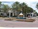 Beautiful fountain with decorative flower beds enhancing the street view and community appeal at 1649 Lake Baldwin Ln, Orlando, FL 32814