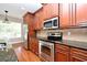 Well-equipped kitchen with stainless steel appliances, wood cabinets and granite counters at 1649 Lake Baldwin Ln, Orlando, FL 32814
