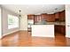 Open kitchen with stainless steel appliances, dark wood cabinets, and a breakfast bar at 1649 Lake Baldwin Ln, Orlando, FL 32814