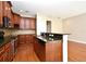 A gourmet kitchen featuring granite countertops, stainless steel appliances, and wood floors at 1649 Lake Baldwin Ln, Orlando, FL 32814