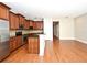 Modern kitchen with granite counters, dark wood cabinetry, and stainless steel appliances at 1649 Lake Baldwin Ln, Orlando, FL 32814