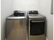 Laundry room features gray front-load washer and dryer at 1649 Lake Baldwin Ln, Orlando, FL 32814