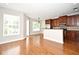 Bright living area with hardwood floors, leading to the kitchen with stainless steel appliances at 1649 Lake Baldwin Ln, Orlando, FL 32814