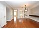Bright living room featuring hardwood floors, mirrors, and a stylish chandelier at 1649 Lake Baldwin Ln, Orlando, FL 32814