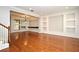 Open living room area with hardwood floors, modern lighting, and custom wall details at 1649 Lake Baldwin Ln, Orlando, FL 32814