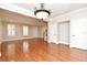Open-concept living room with hardwood floors and stairs to the next level at 1649 Lake Baldwin Ln, Orlando, FL 32814