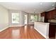 Open-concept living area with hardwood floors flowing into the kitchen and dining spaces at 1649 Lake Baldwin Ln, Orlando, FL 32814