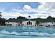 Community swimming pool with lap lanes and a clubhouse in the background at 1649 Lake Baldwin Ln, Orlando, FL 32814