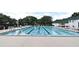 Community swimming pool with lap lanes and plenty of seating around it at 1649 Lake Baldwin Ln, Orlando, FL 32814
