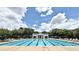 Community swimming pool with lap lanes and chairs for lounging by the pool at 1649 Lake Baldwin Ln, Orlando, FL 32814
