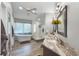 Luxurious bathroom with freestanding tub, glass shower, and marble countertop vanity at 1717 Fountainhead Dr, Lake Mary, FL 32746