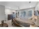This primary bedroom features a large bed with access to the backyard through double doors and an adjacent dresser at 1717 Fountainhead Dr, Lake Mary, FL 32746