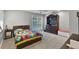 This bedroom has an adjacent bookshelf, dresser, and access to natural light from the backyard at 1717 Fountainhead Dr, Lake Mary, FL 32746