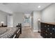 The hallway between the bedroom and bathroom has carpet, an adjacent dresser, and a view to the bathroom at 1717 Fountainhead Dr, Lake Mary, FL 32746