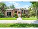 Beautiful brick home featuring a meticulously maintained lawn and mature landscaping at 1717 Fountainhead Dr, Lake Mary, FL 32746