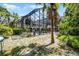 An exterior shot of a home with a screened-in pool and lush, tropical landscaping around the backyard at 1717 Fountainhead Dr, Lake Mary, FL 32746