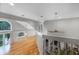 This hallway overlooks the downstairs living room and has a view to a large window at 1717 Fountainhead Dr, Lake Mary, FL 32746