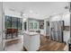 Bright kitchen featuring stainless steel appliances, a center island, breakfast nook, and wood floors at 1717 Fountainhead Dr, Lake Mary, FL 32746
