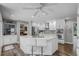 Updated kitchen with white cabinets, marble counters, and stainless appliances offers a stylish design at 1717 Fountainhead Dr, Lake Mary, FL 32746