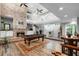 Spacious living room with a fireplace, billiard table, and staircase at 1717 Fountainhead Dr, Lake Mary, FL 32746