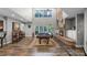 Open-concept living room with a fireplace, bar, billiard table, and backyard views at 1717 Fountainhead Dr, Lake Mary, FL 32746