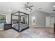 Comfortable main bedroom with neutral tones, a canopy bed, and a bright atmosphere at 1717 Fountainhead Dr, Lake Mary, FL 32746
