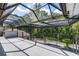 This elevated outdoor patio provides stunning views of the lush surroundings and features a screened-in design at 1717 Fountainhead Dr, Lake Mary, FL 32746