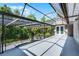 This expansive outdoor patio features a screened-in area, offering a serene spot to relax and enjoy the scenic views at 1717 Fountainhead Dr, Lake Mary, FL 32746
