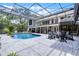 The screened-in pool, deck, and outdoor lounge create a relaxing backyard retreat for entertaining and recreation at 1717 Fountainhead Dr, Lake Mary, FL 32746