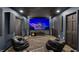 Entertainment room with theater screen, surround sound and comfortable seating at 1717 Fountainhead Dr, Lake Mary, FL 32746
