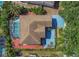 Aerial view showcasing a home with a screened pool and brick patio at 1731 Knotting Hill Dr, Orlando, FL 32835