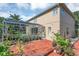 Beautiful backyard with brick patio and screened-in pool, creating a private oasis at 1731 Knotting Hill Dr, Orlando, FL 32835