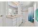 Bright bathroom with a single sink vanity and a shower-tub combination with white tile at 1731 Knotting Hill Dr, Orlando, FL 32835