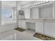 Bright bathroom featuring double sinks, a large mirror, and a soaking tub under a window at 1731 Knotting Hill Dr, Orlando, FL 32835