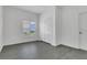Bedroom with wood-look flooring, double closet and a window with plantation shutters at 1731 Knotting Hill Dr, Orlando, FL 32835