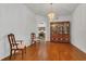 Open dining room featuring chandelier and hardwood floors at 1731 Knotting Hill Dr, Orlando, FL 32835