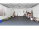 Spacious garage with plenty of storage space, natural light and a roll-up door at 1731 Knotting Hill Dr, Orlando, FL 32835