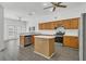 Modern kitchen featuring stainless steel appliances, a center island, and eat-in dining at 1731 Knotting Hill Dr, Orlando, FL 32835