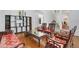 Living room with hardwood floors, custom furniture, and staircase at 1731 Knotting Hill Dr, Orlando, FL 32835